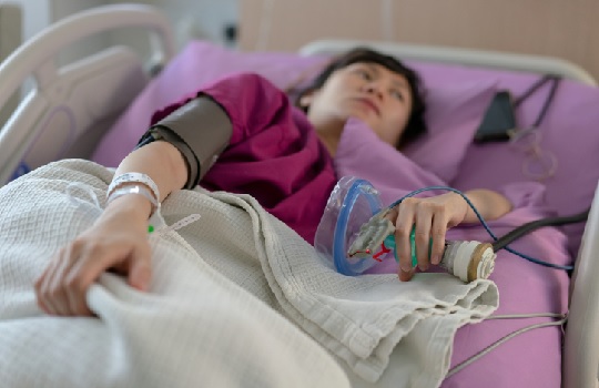 Woman in a hospital bed